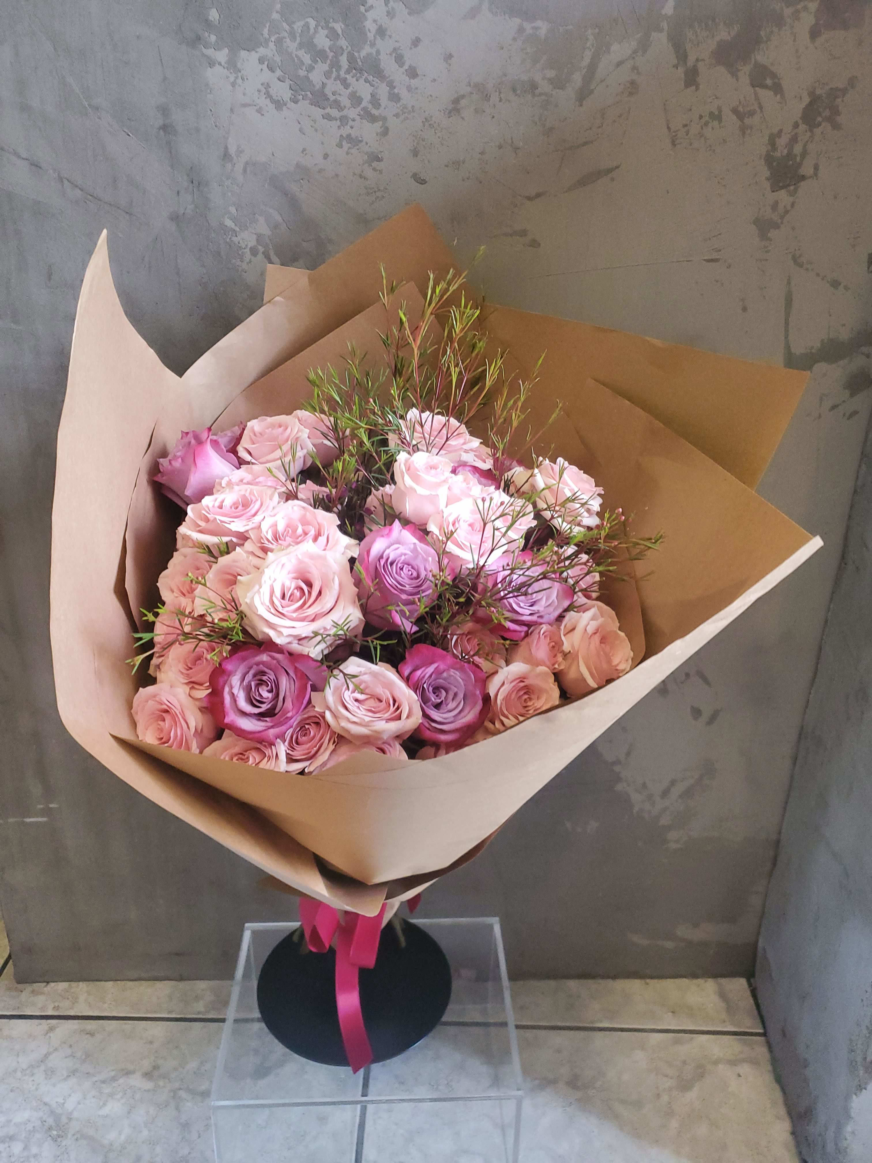 A Bouquet of Roses - A beautiful dozen of premium roses.  Please specify color preference on order. Wrapped in custom craft paper with silk ribbon giving a shabby chic look, perfect for rose lovers.