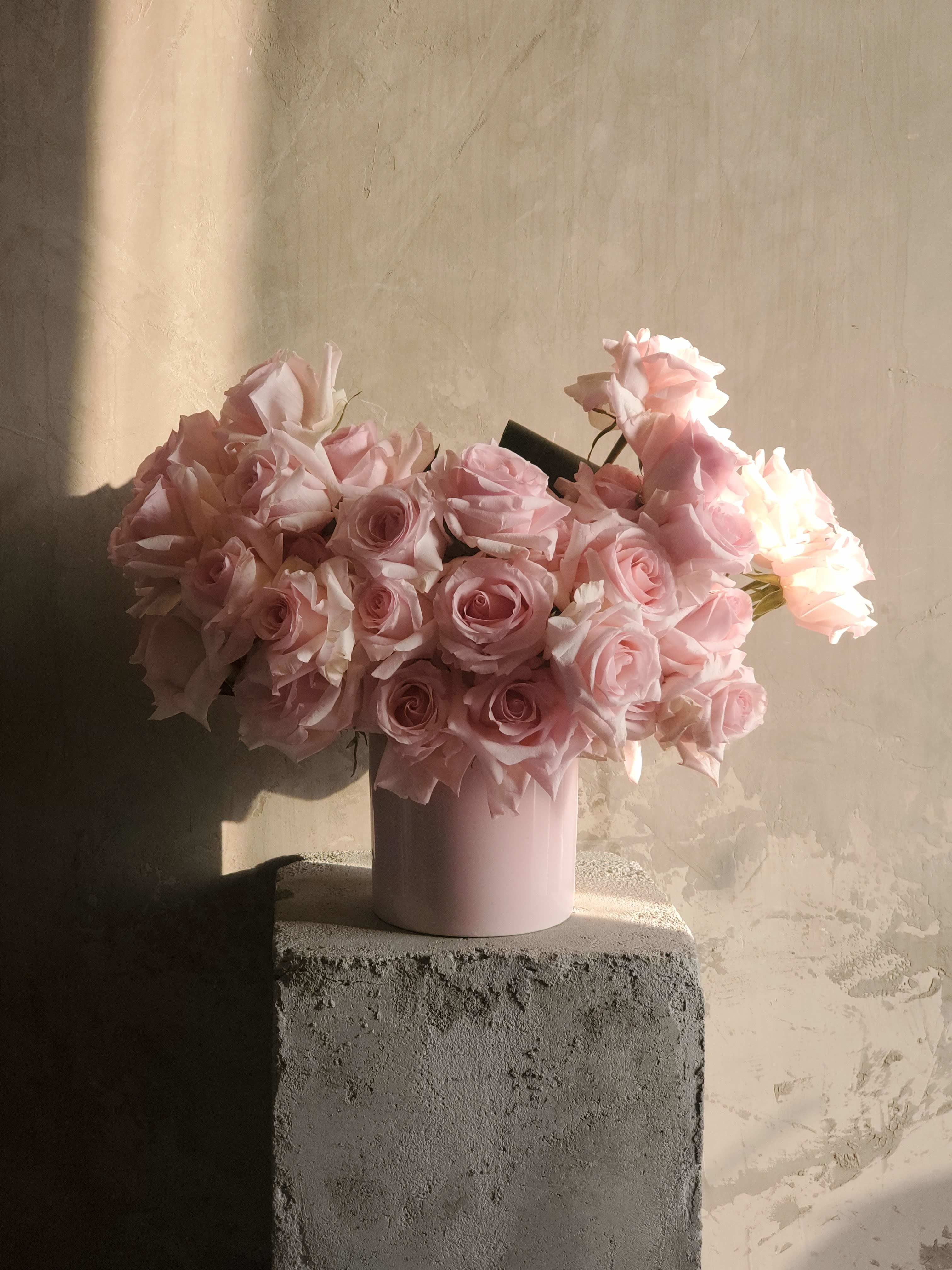 Pretty in PInks - The elegant and compassionate  composition consists of 40+ light pink roses.  It will match well for any occasion.