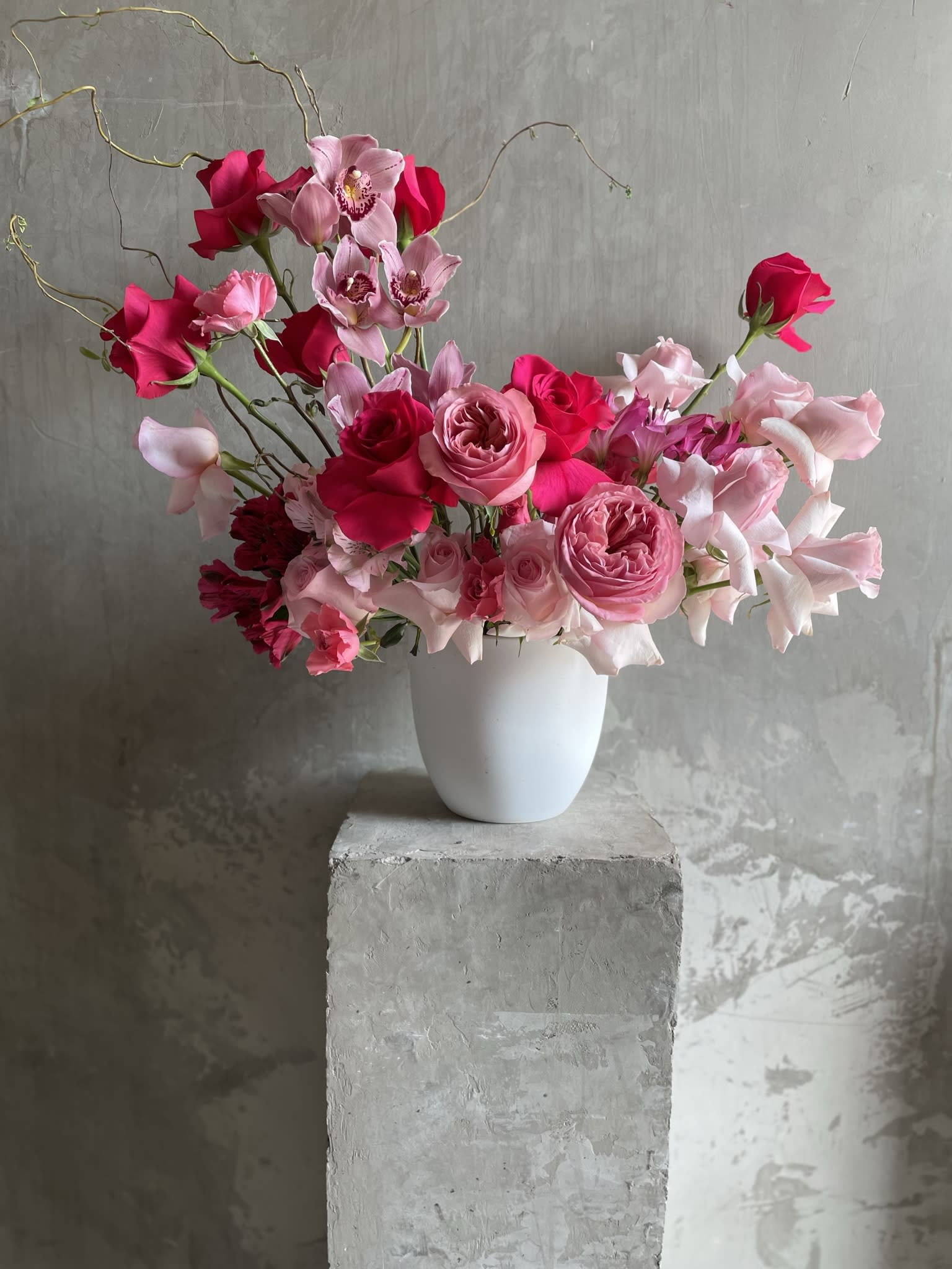 Pink Crush - A pink mixed flower arrangement can be a stunning and eye-catching display of beauty.  Imagine a lush, overflowing arrangement that bursts with the vibrant energy of different types of pink flowers.  The end result would be a breathtaking display of pink floral abundance that is both romantic and feminine, perfect for any occasion. 