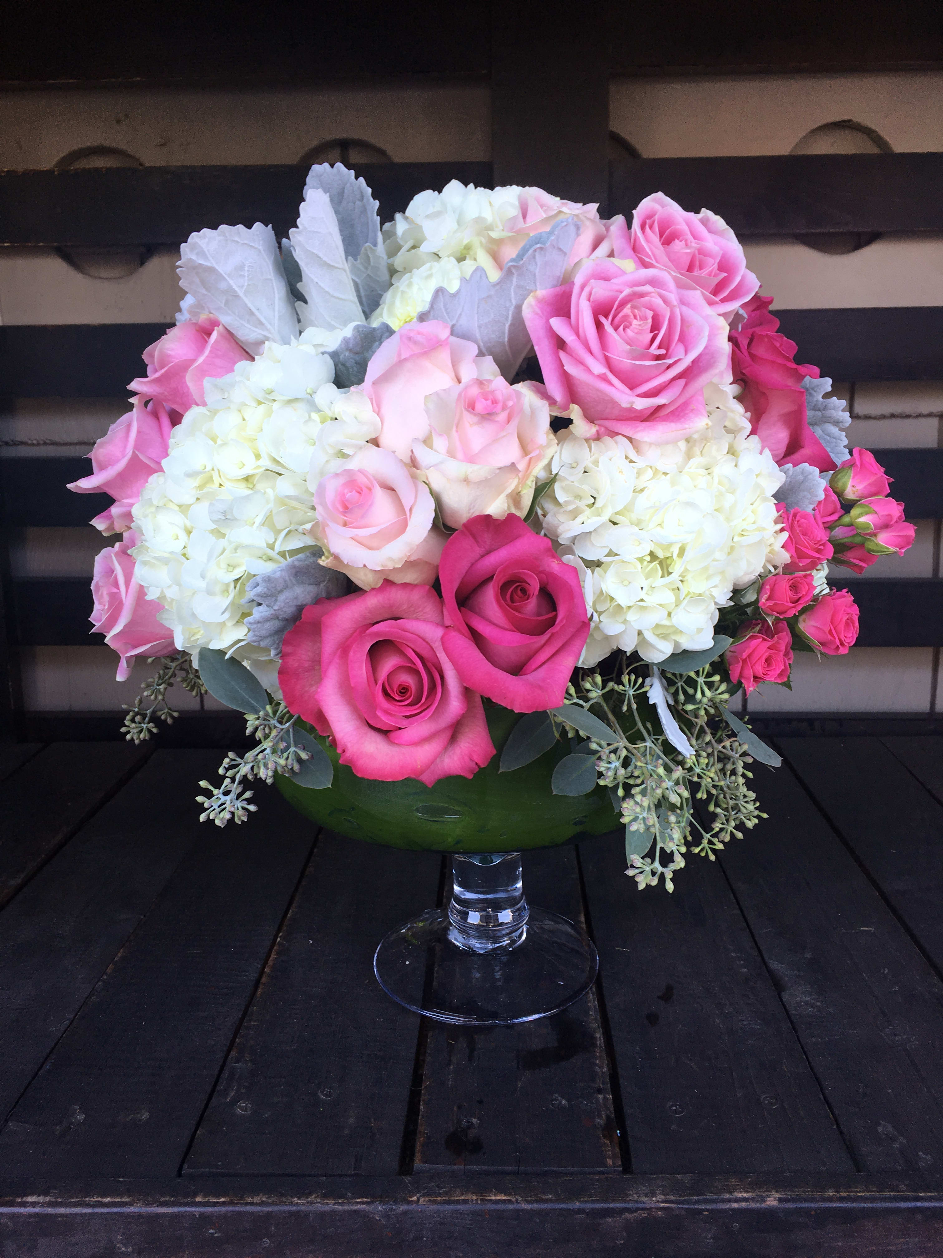 Pink and white rose bouquet in a glass vase