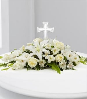 The FTD® Eternal Light™ Bouquet - The FTD® Eternal Light™ Bouquet is an exquisite arrangement that will bring a luminous beauty to life's most precious moments. An exquisite glass cross is surrounded by white roses, gladiolus, Peruvian Lilies, Oriental Lilies, vibrant Boston fern fronds and lush greens to create a wonderful arrangement ideally suited for a memorial service, baptism, First Communion, christening or wedding. GOOD bouquet includes 11 stems. Approximately 7"H x 28"W. BETTER bouquet includes 14 stems. Approximately 7"H x 29"W. BEST bouquet includes 18 stems. Approximately 8"H x 30"W. Your purchase includes a complimentary personalized gift message.