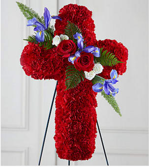 The FTD® Living Cross™ Easel - You can be sure that this exquisite expression of sympathy, crafted in the white of heavenly hope, will make a moving and impressive addition to a wake, funeral or burial service. Reflecting the form of a "teardrop", this generously scaled spray constructed by a local FTD artisan florist includes white pompons, roses and Asiatic lilies accented with a white satin ribbon bow. It comes on a metal stand to give it the ultimate flexibility for display at a funeral home, in a church or at a cemetery.  Your purchase includes a complimentary personalized gift message.