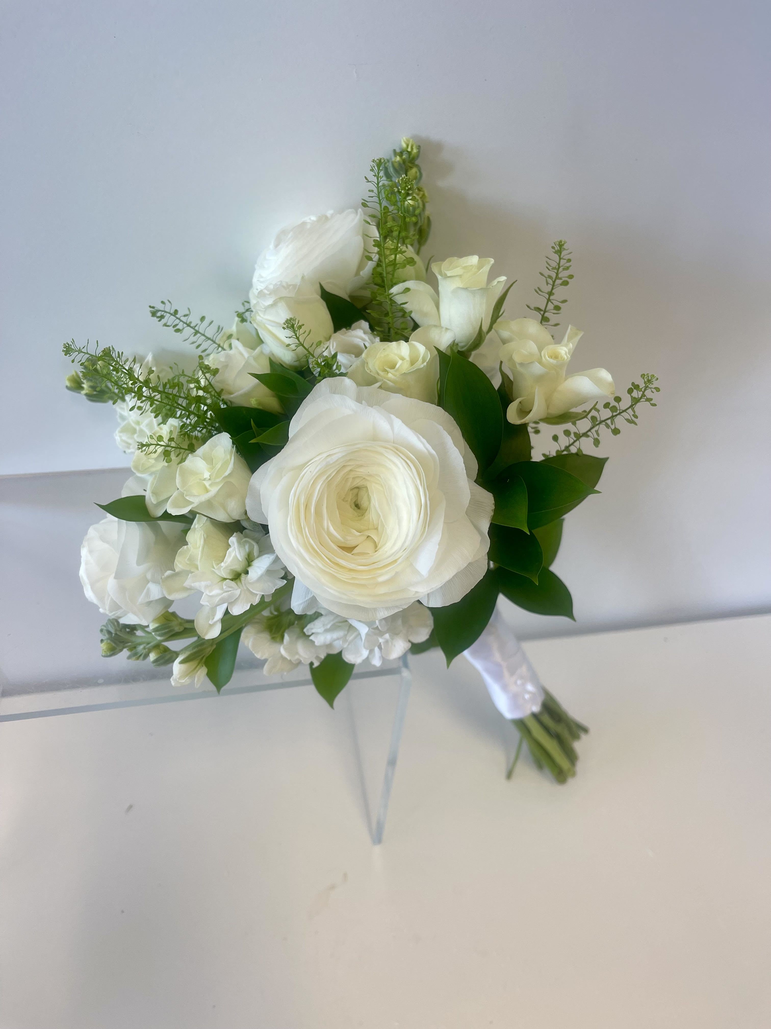 White bridal bouquet with roses and ranunculus