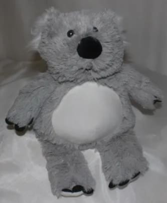 Gray plush teddy bear with a white belly and black nose