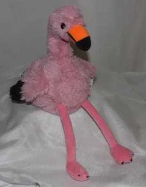 Pink plush flamingo toy with an orange-and-black beak