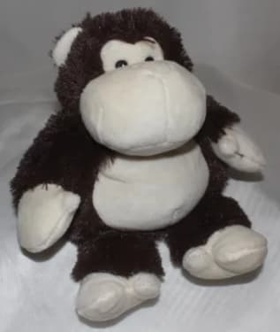Plush monkey toy with a white face and belly