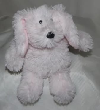 Pink plush dog toy with floppy ears and black nose