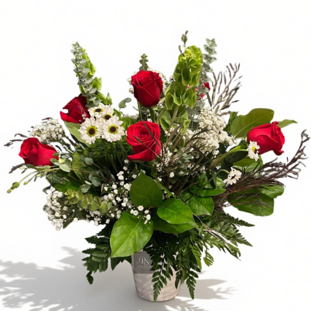 Red roses and white daisies in a white vase