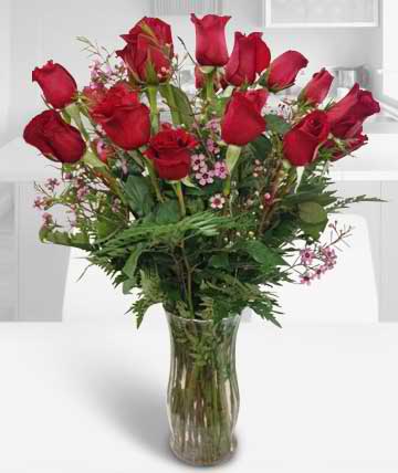 Bouquet of red roses in a clear glass vase