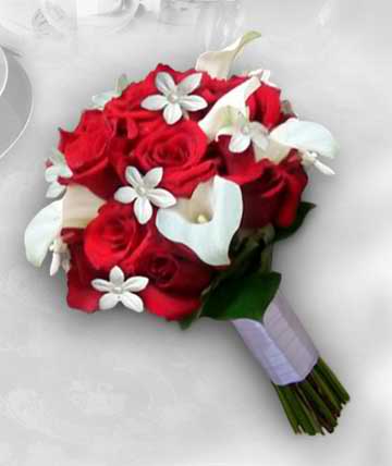 Red rose bouquet with white calla lilies and small white flowers