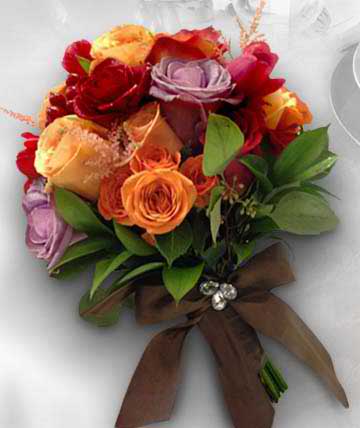Bouquet of multicolored roses tied with a brown ribbon
