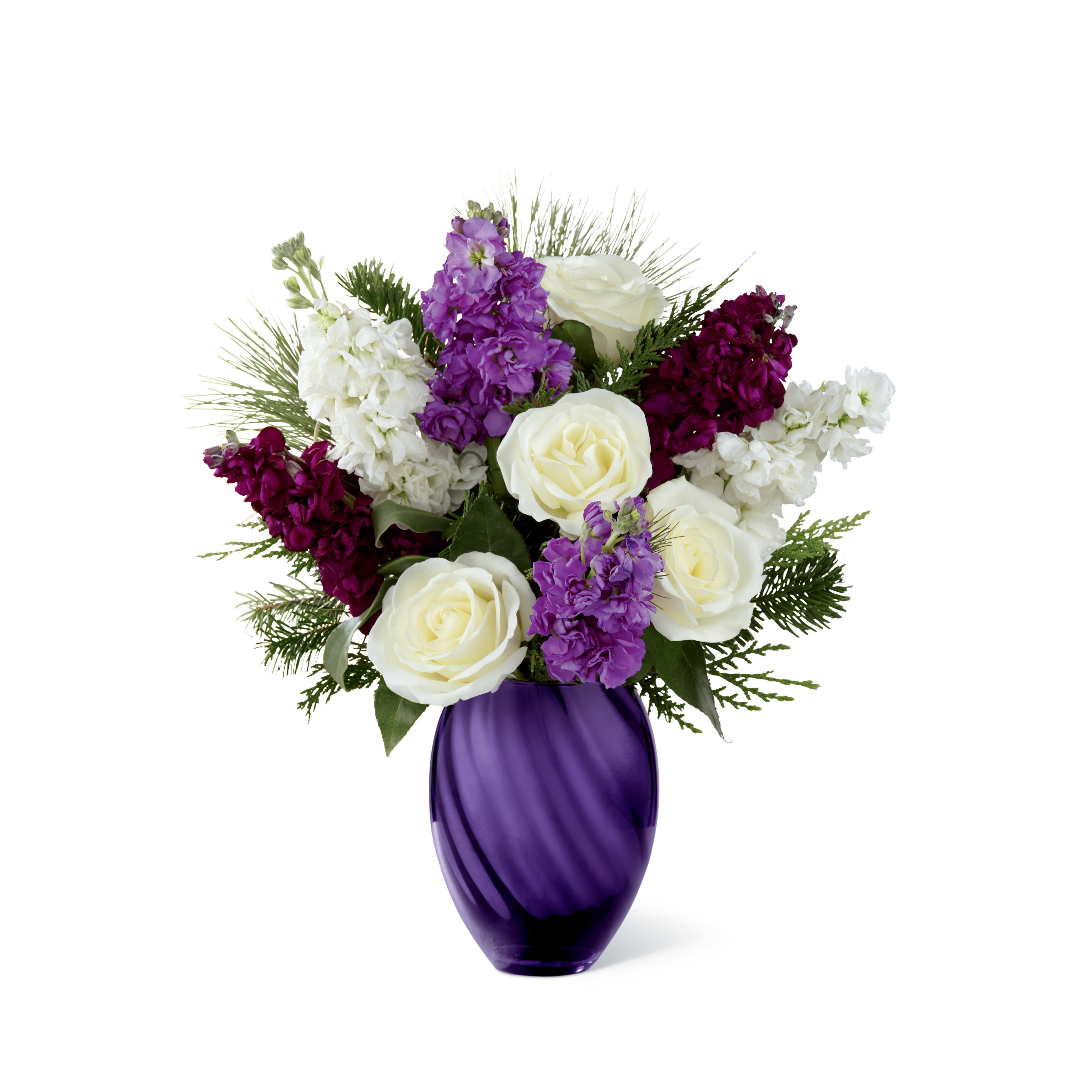 The FTD® Joyful™ Bouquet by Vera Wang - Item Number: 15-C11s  The FTD® Joyful™ Bouquet by Vera Wang employs enchanting purple hues to send holiday cheer and sweet sophistication to your special recipient this Christmas season! Unforgettable white roses are surrounded by fragrant stock stems in the shades of plum, lavender and white, perfectly accented with an assortment of lush holiday greens to create an eye-catching holiday display. Presented in a shining purple designer glass vase with a metallic finish, this mixed flower bouquet sends your warmest season's greetings to friends, family and loved ones, capturing the essence of the magic of the season with each eye-catching bloom.