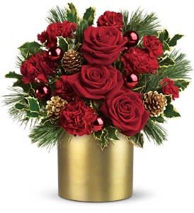 Teleflora's Holiday Elegance - Add a little Couture to Christmas this year! Your family and friends will think you're golden when you send them this stylish holiday arrangement.  Stunning red roses and carnations, holly, pinecones and shiny red ornament balls are perfectly arranged in a satiny gold cylinder vase . It's a 24-karat gift!  Approximately 13 1/2" W x 14 1/2" H  Orientation: One-Sided  As Shown : T115-1A Deluxe : T115-1B Premium : T115-1C