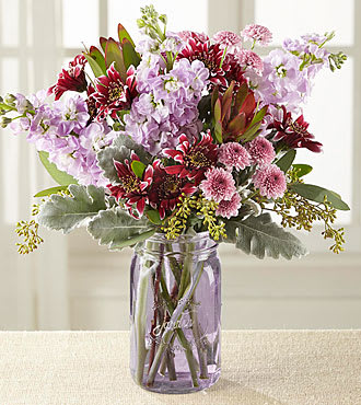 FTD Harvest Magic Bouquet - Harvest Magic Bouquet blooms with alluring purples to help you send your warmest wishes. Hand gathered at select floral farms, this stunning mixed flower bouquet displays lavender and purple hues amongst soft green foliage to create a bouquet picked just for you to express your caring kindness in celebration of a birthday, Thanksgiving, Grandparent's Day, or to simply say thanks. Bouquet includes: lavender gilly flower, purple daisies, lavender chrysanthemums, Dusty Miller stems, seeded eucalyptus, lush greens and lavender mason jar vase. BETTER bouquet is approx. 15"H x 13"W.
