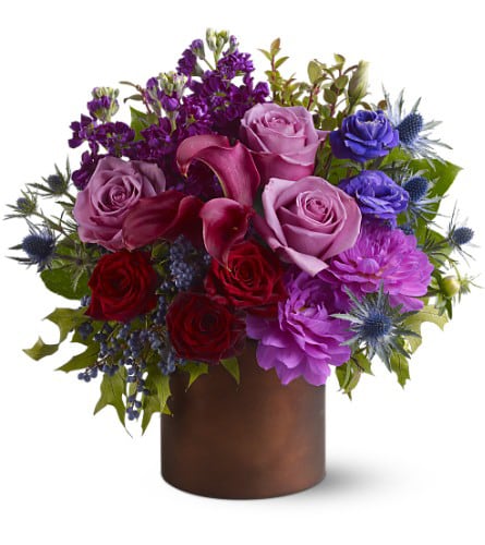 Plum Gorgeous Bq - Do you know someone who loves the color purple? For a truly luscious display, send them this plum-toned mix of blossoms in shades of purple, lavender and wine, arranged in a Teleflora Satin Collection container that will be reused again and again. It's like two gifts in one!
