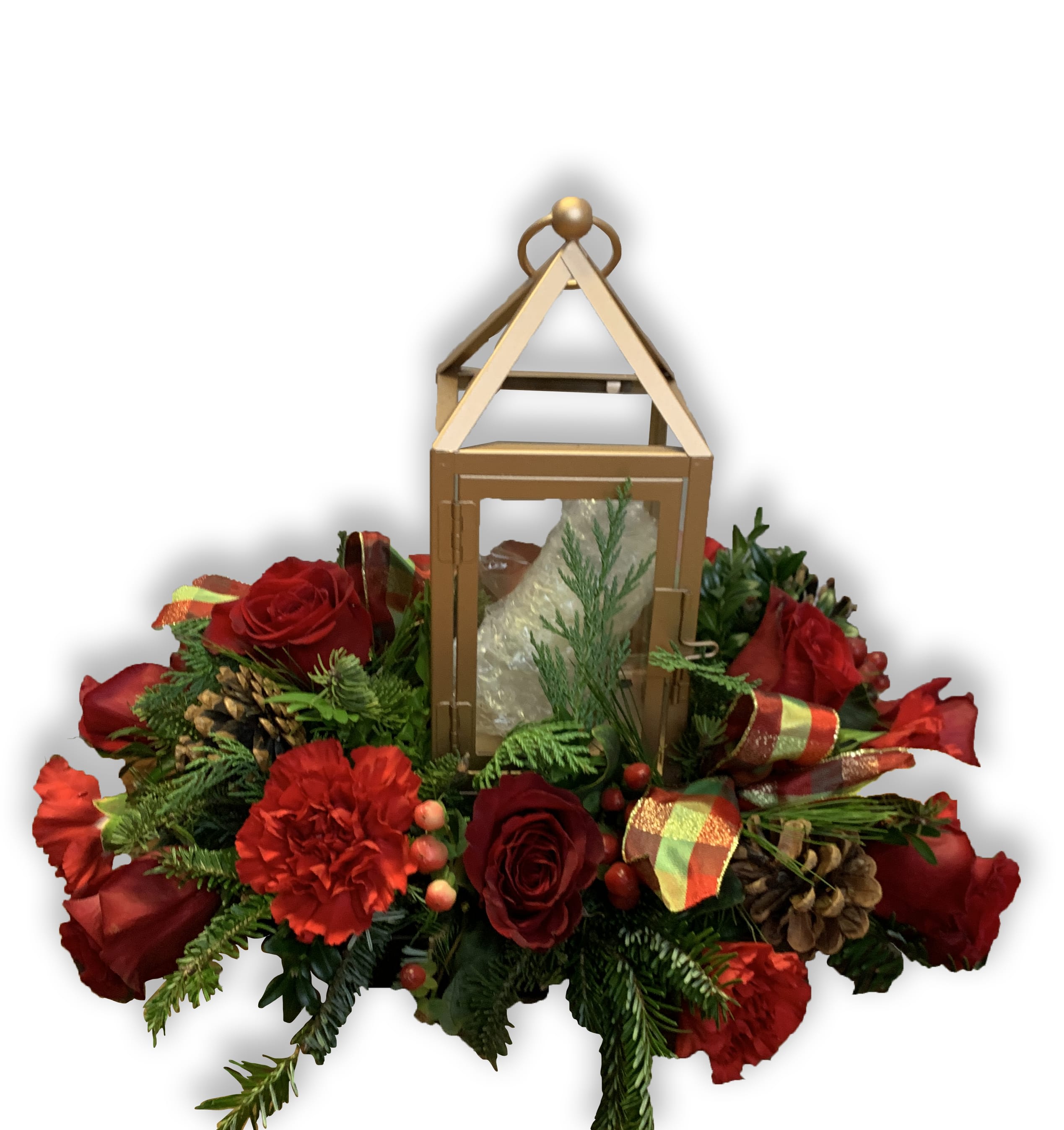 Red roses and carnations arranged around a gold lantern