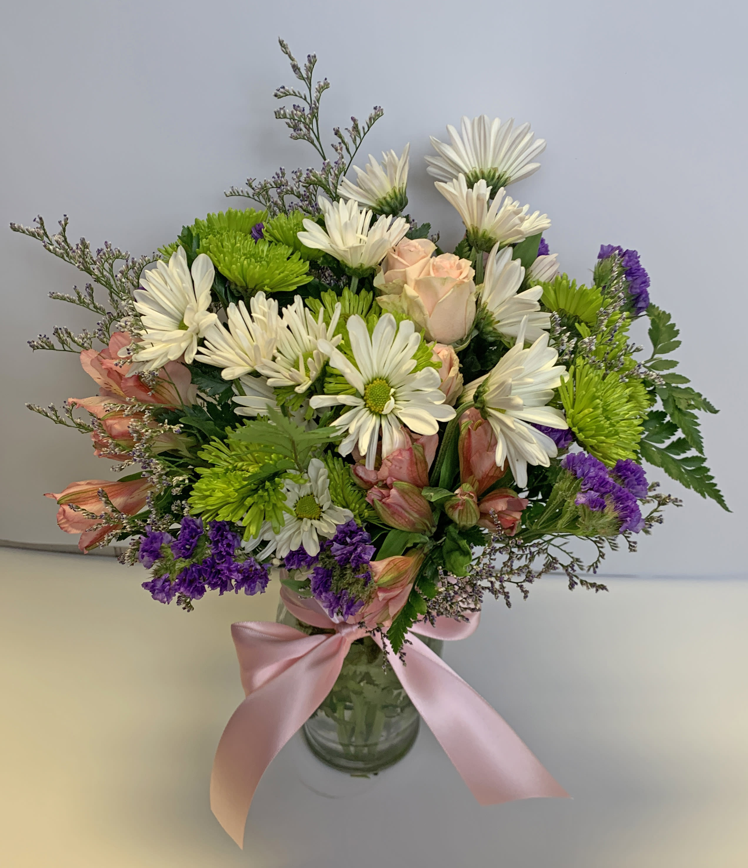 Pretty Please by Teleflora - Looking for the prettiest bouquet in town? We've got the perfect all-around choice! Pretty Please is a flower bouquet with all the right stuff - a lovely mix of fresh flowers in breezy shades of pink, white, lavender and more at a wonderfully reasonable price, all tied up with a big pink bow. A great way to make someone smile. 