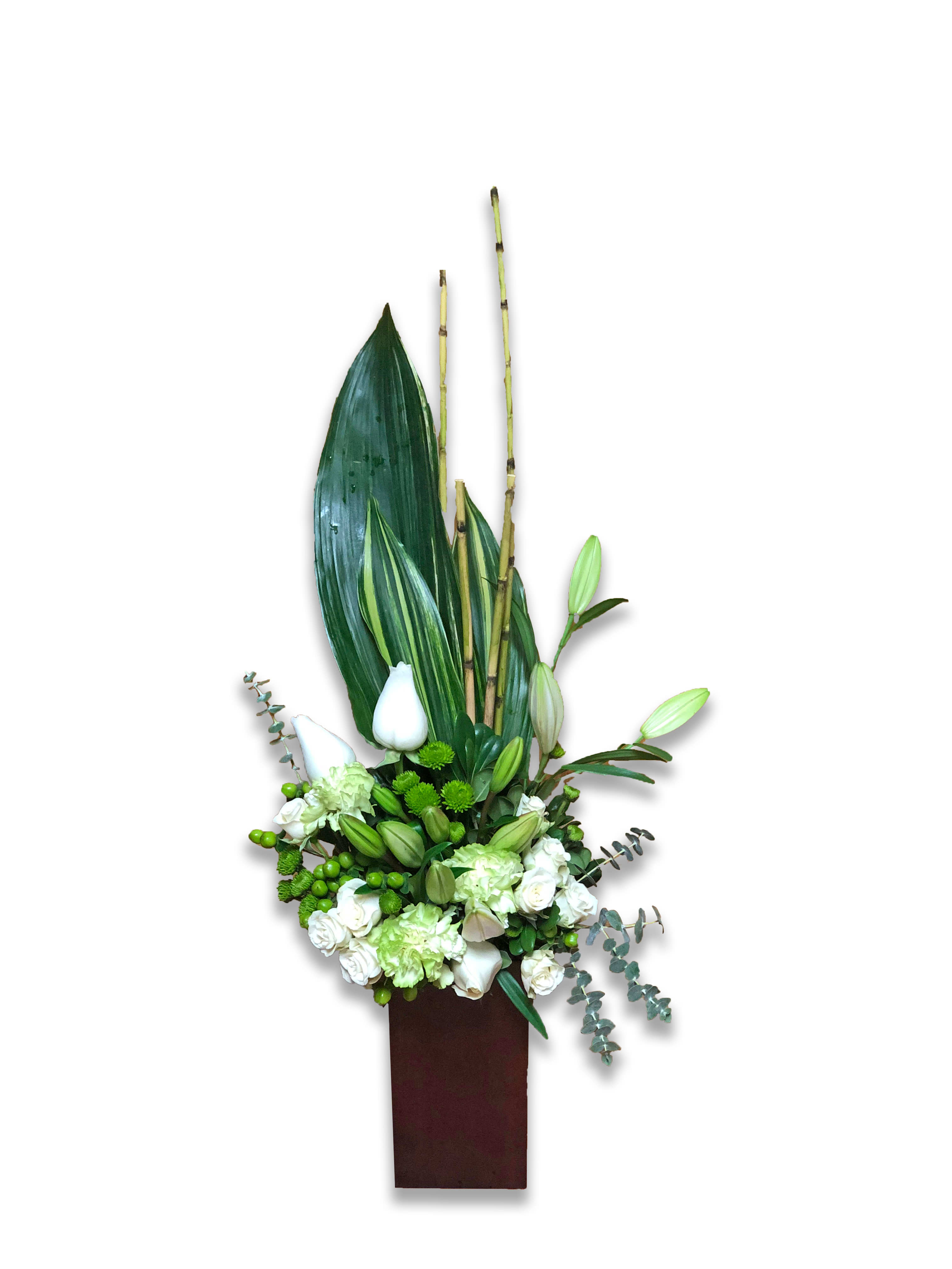 Teleflora's Peace And Harmony Bouquet - Send zen. Pure white blooms and fresh tropical greens combine to stunning effect in this stylish arrangement. Presented in a contemporary bamboo vase they'll enjoy for years to come. 
