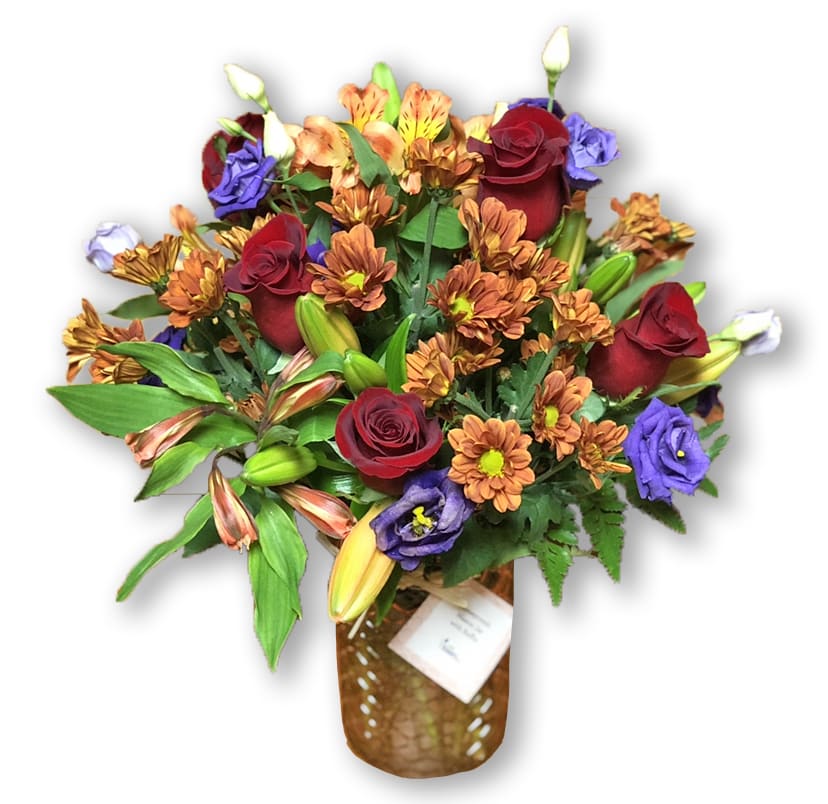 FTD Many Thanks Bouquet - Captivating fall color abounds in this simply stunning autumn bouquet, helping you express gratitude and thanks with every sunlit bloom. Gorgeous Cherry Brandy roses are a standout sensation artistically arranged amongst orange Peruvian lilies, Peach Asiatic lilies, purple double lisianthus, bronze chrysanthemums, and lush greens presented in a geometric amber handblown glass vase. A perfect surprise for your friends and family in honor of the Thanksgiving holiday! GOOD bouquet includes 10 stems. Approx. 15"H x 12"W.