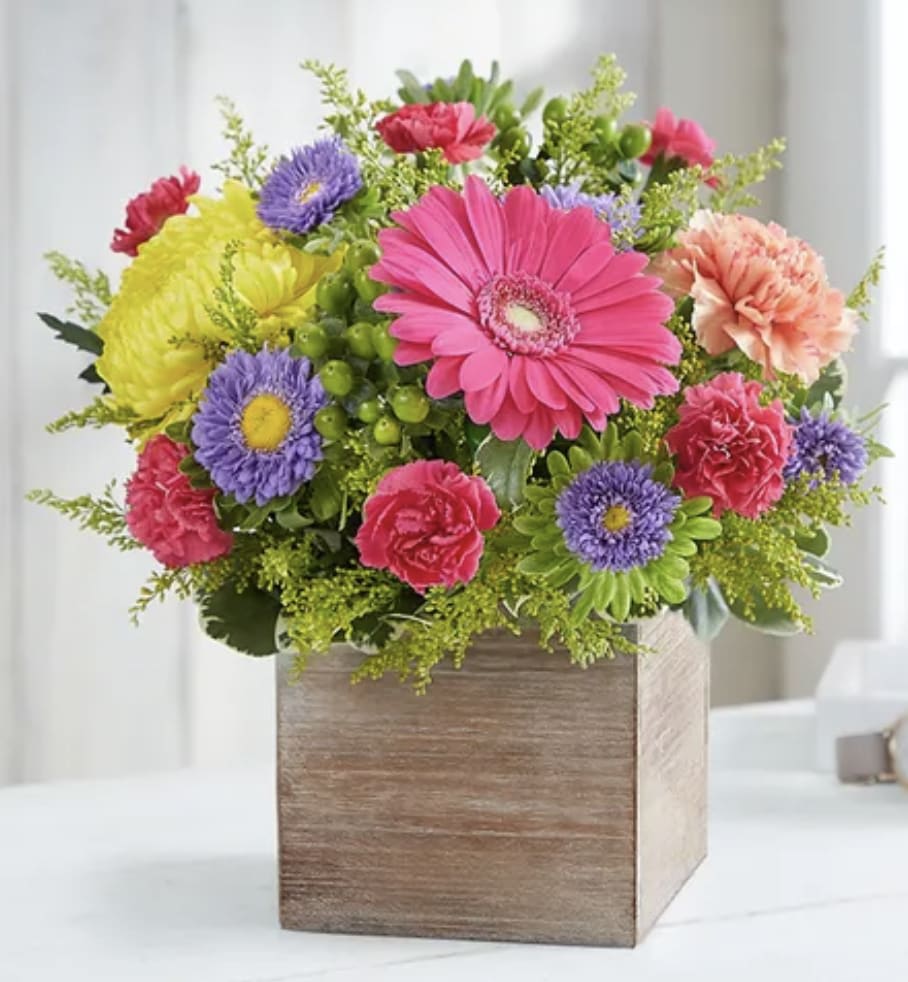 Colorful mixed flower arrangement in a wooden box