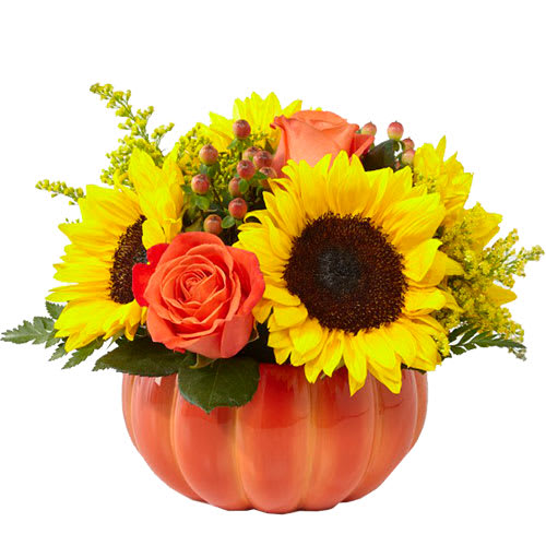 Sunflowers and orange roses in a pumpkin-shaped vase