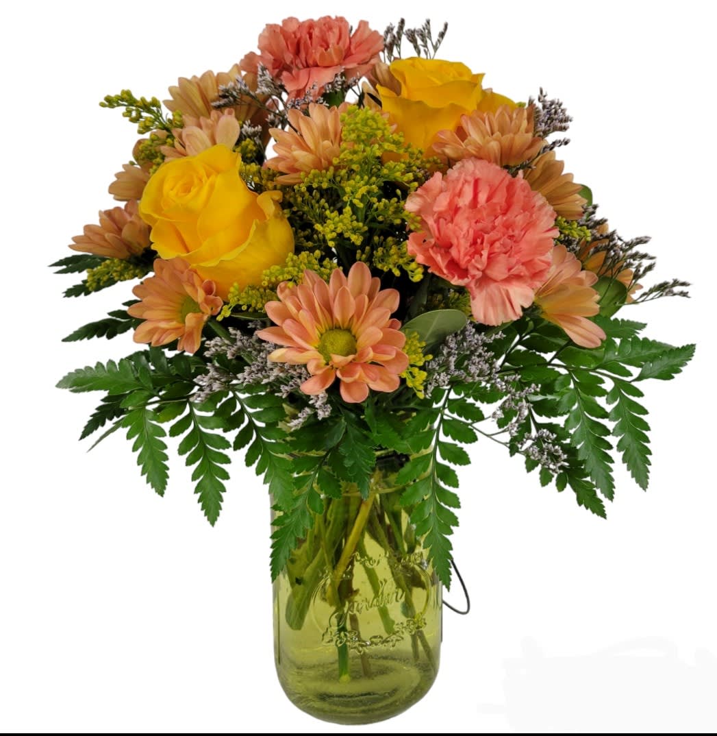FALL DELIGHT - A mix  of flowers such as roses, carnations and daisies with accents of solidago and limonium arranged in a colored glass mason jar. 