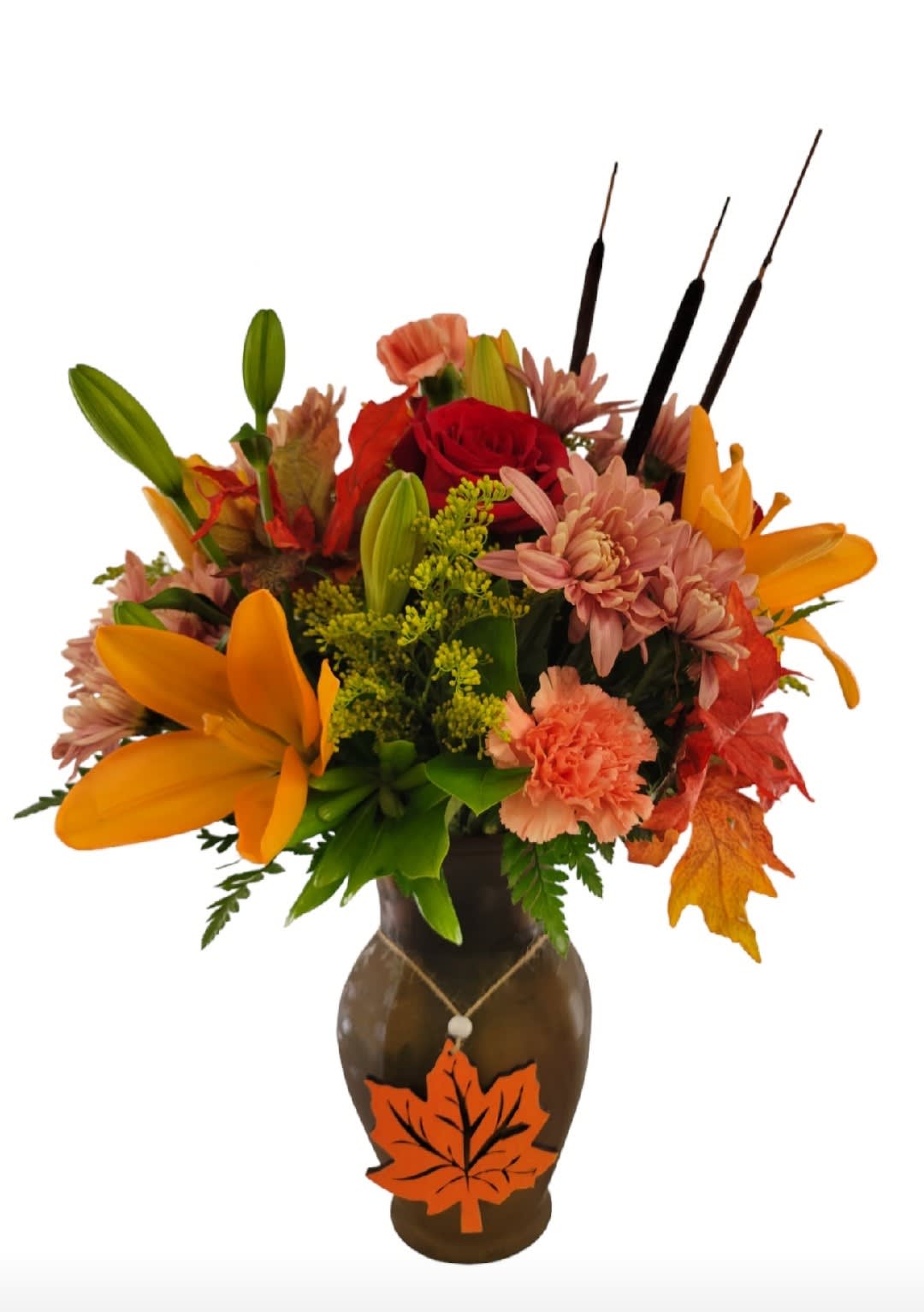 Autumn bouquet with lilies, roses, and mums in a brown vase