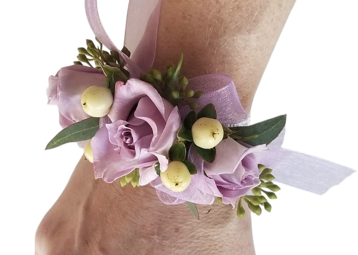 Lavender rose wrist corsage with ribbon and pale berries