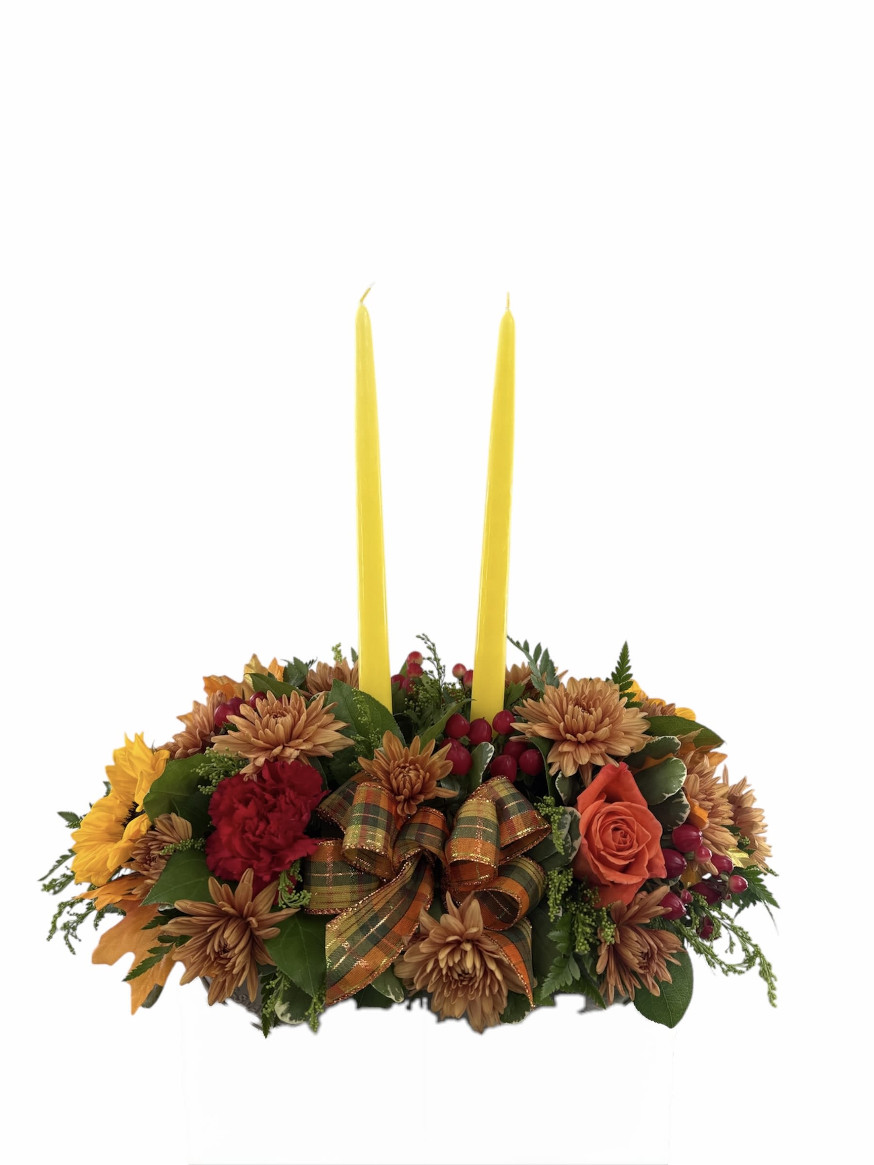Autumn floral centerpiece with two yellow taper candles
