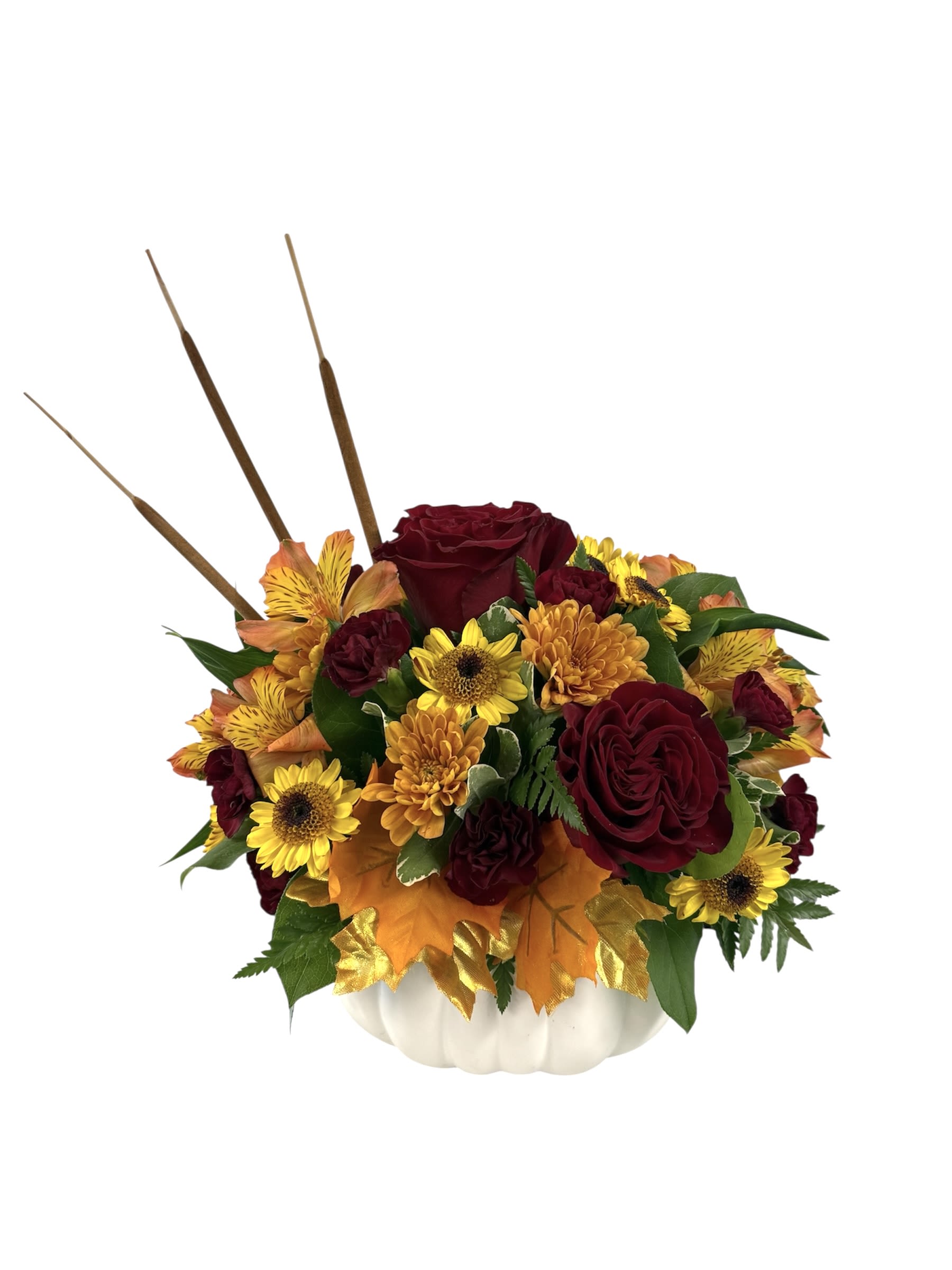 Cinnamon-n-Spice Pumpkin - A beautiful fall-themed arrangement presented in a white pumpkin-shaped container. The primary colors are deep crimson red and vibrant golden yellow with pops of burnt orange. This arrangement perfectly captured the warmth richness of the fall season!