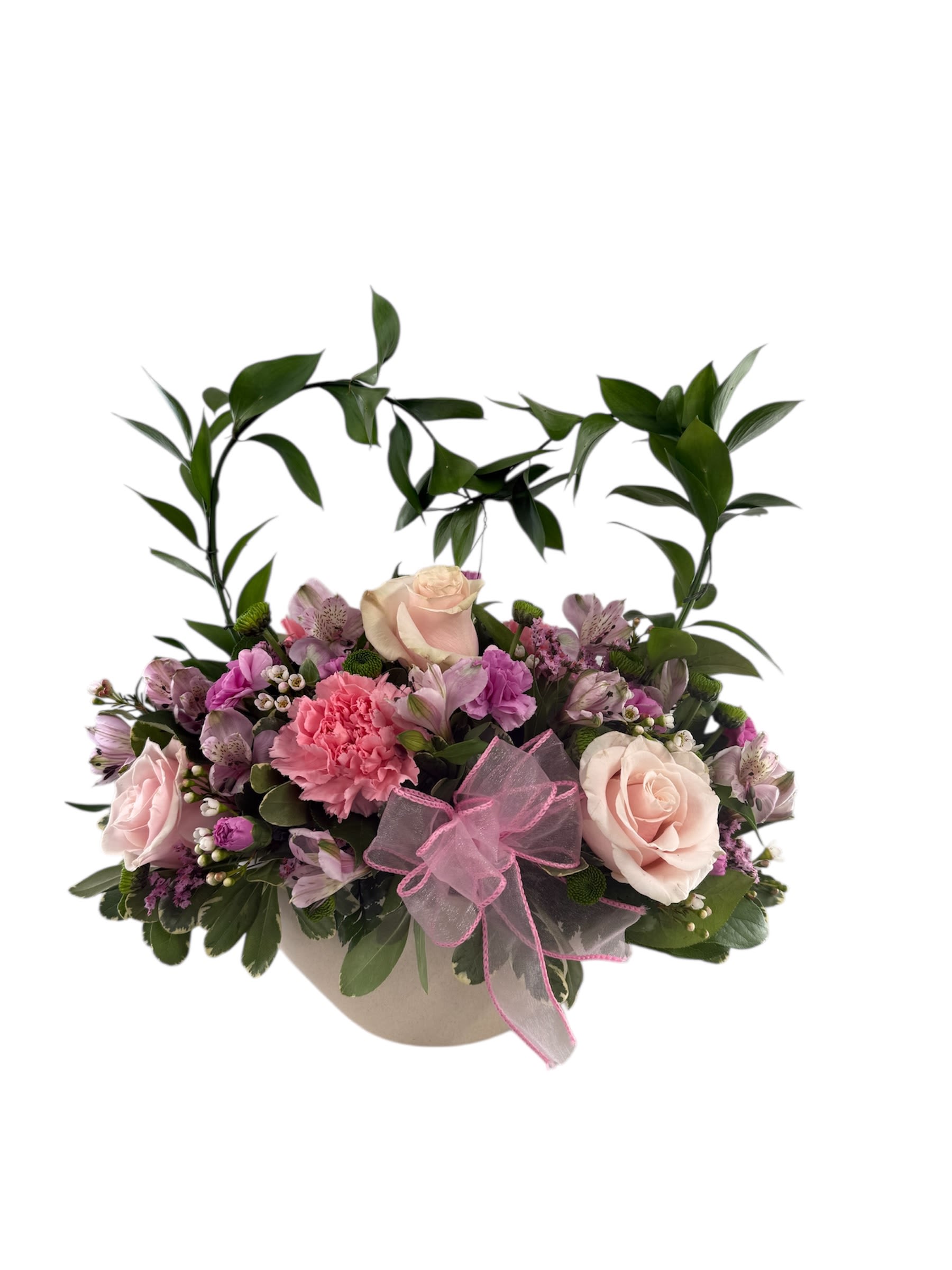Pink and cream floral arrangement in a round box with a pink bow