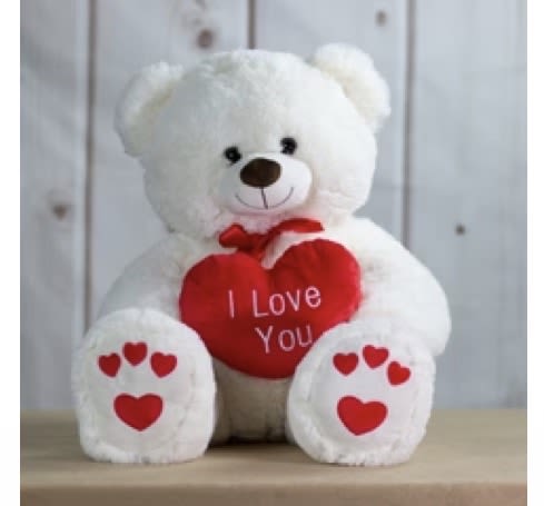 White teddy bear holding a red heart that says I Love You