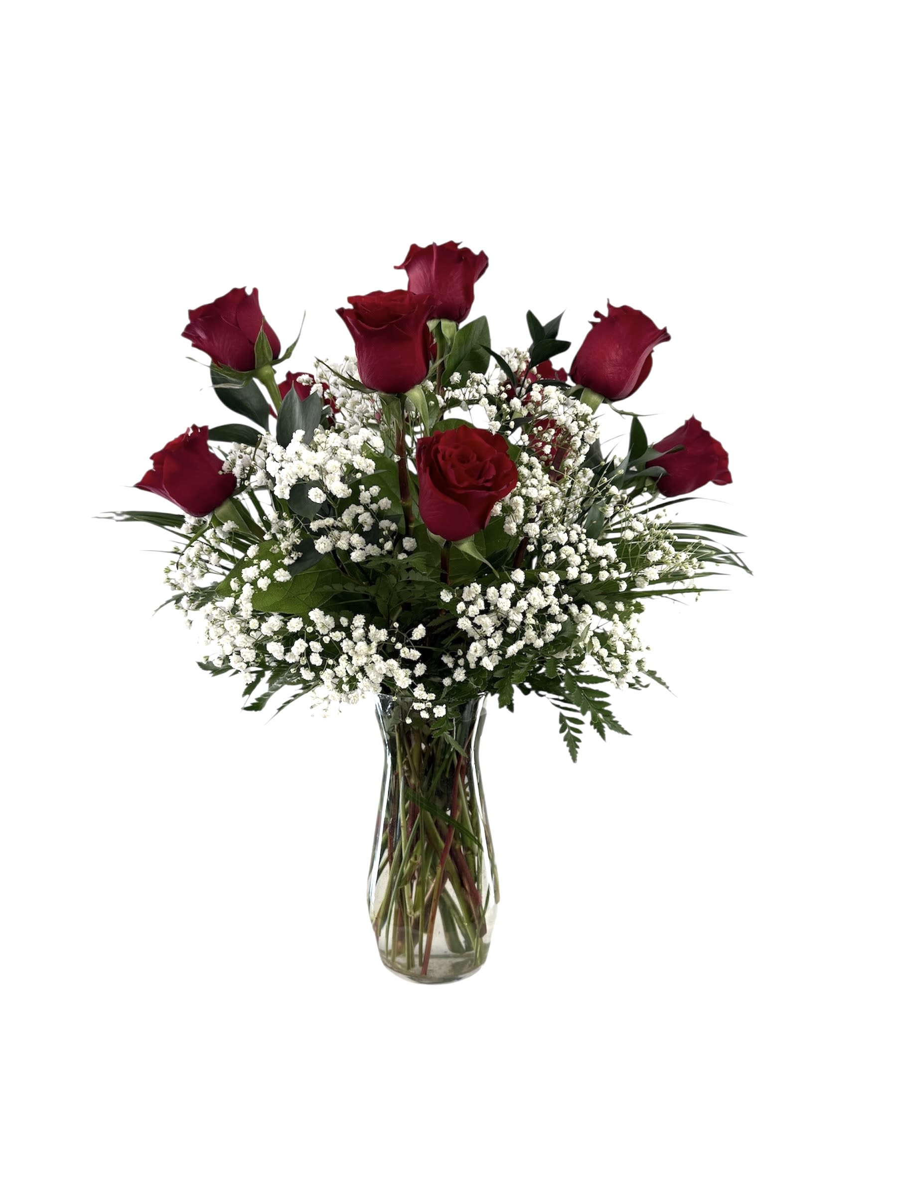 Red roses and baby's breath in a clear glass vase