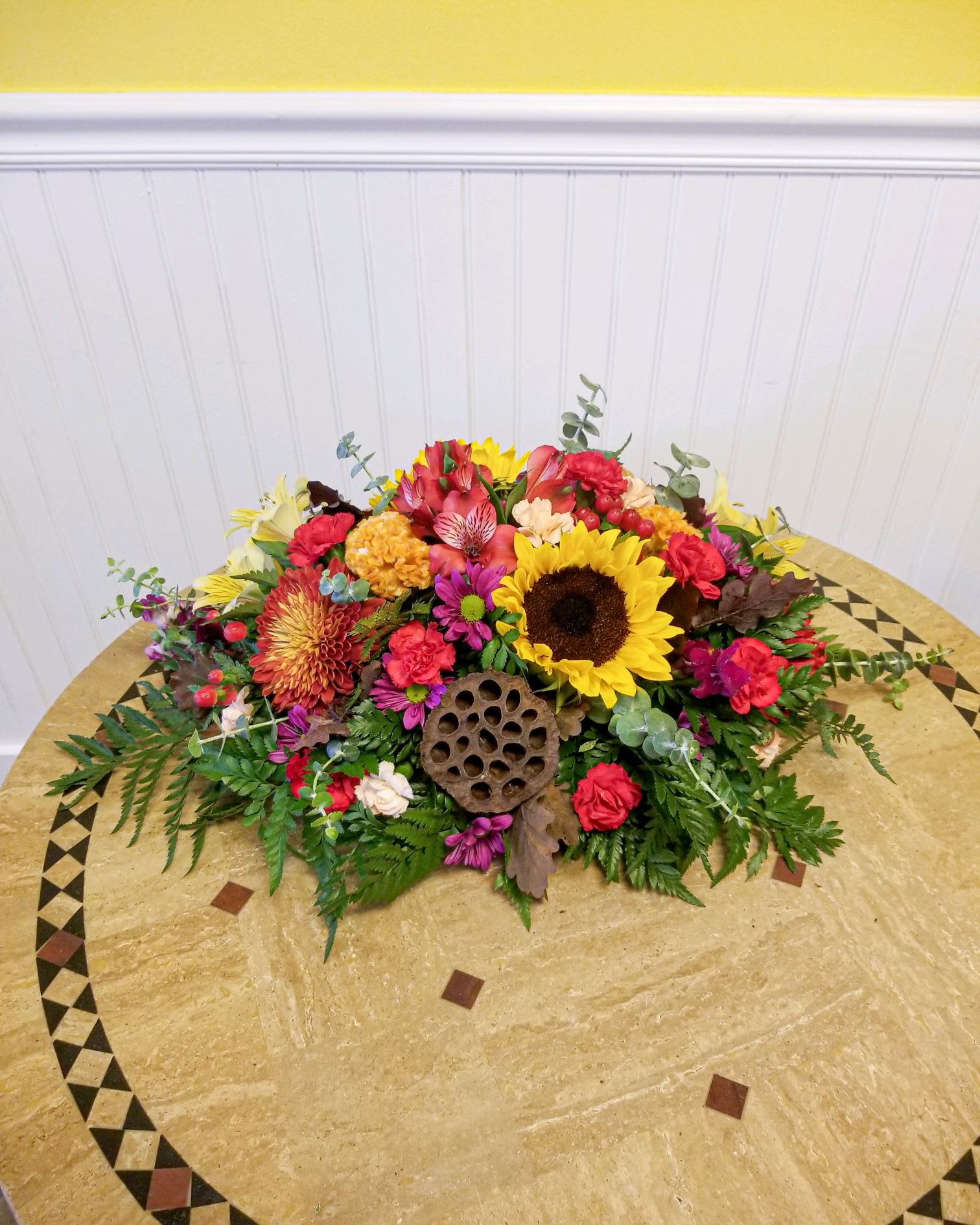 Colorful mixed flower arrangement on a round table