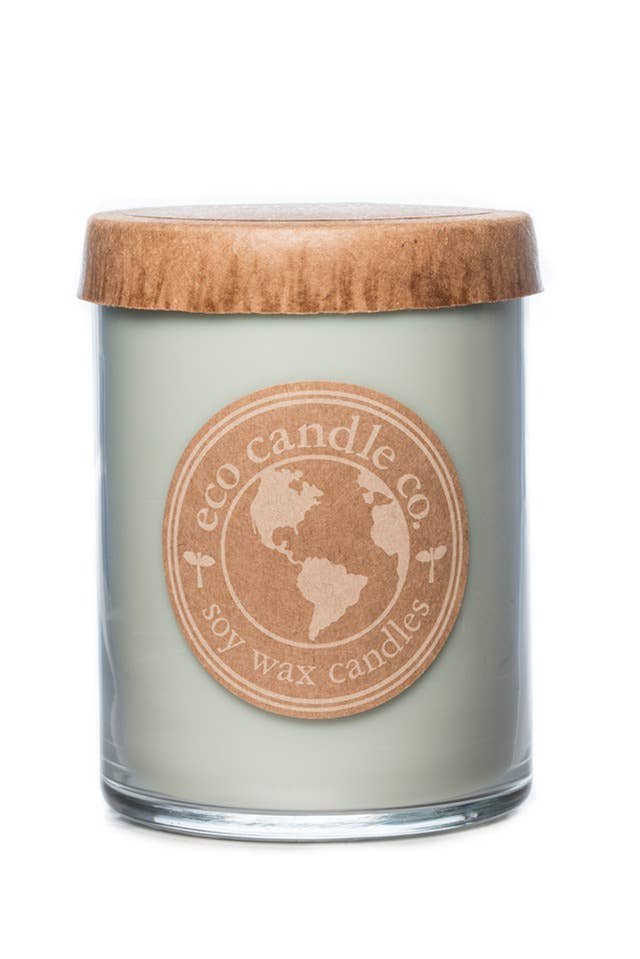 Soy wax candle in a glass jar with a wooden lid
