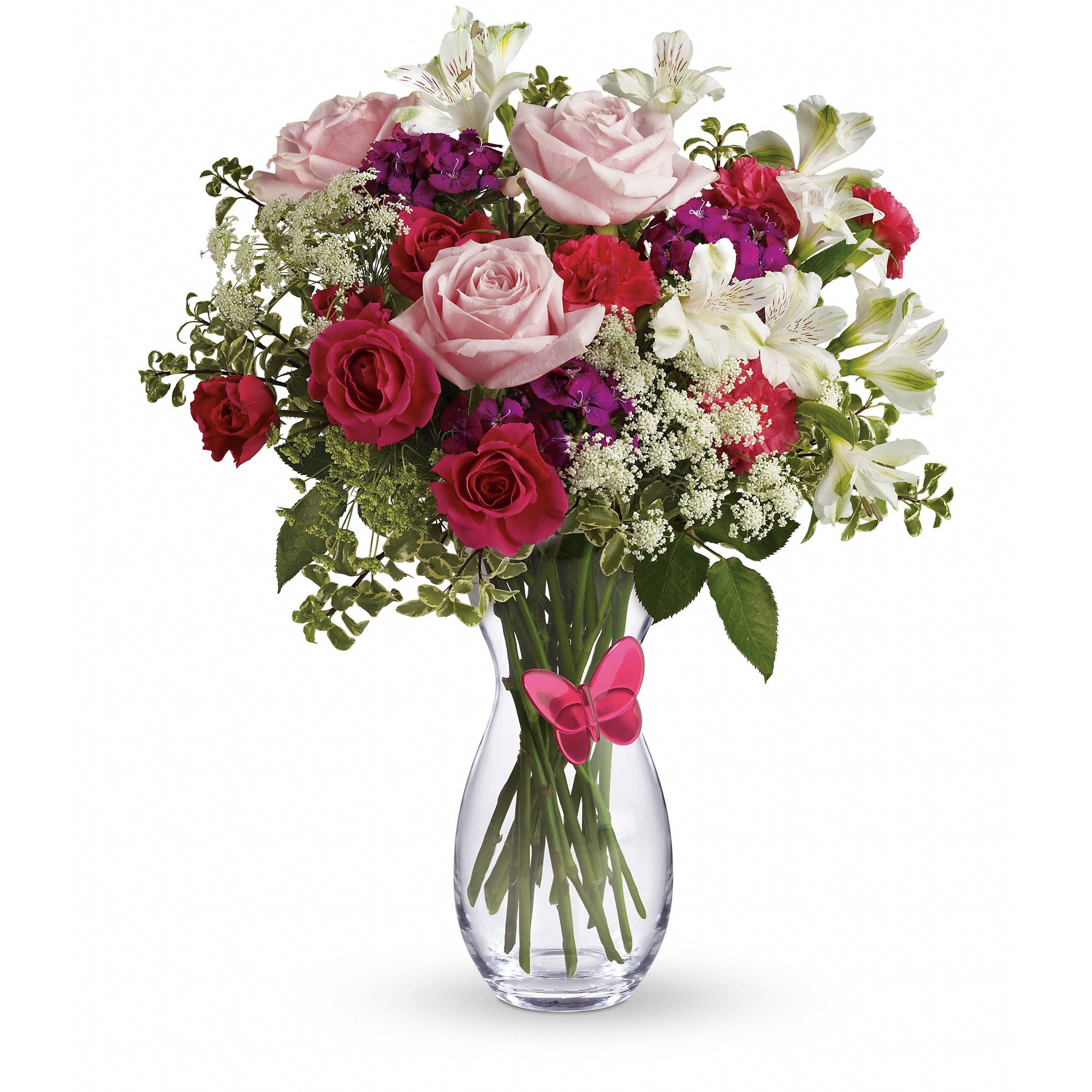 Pink and white bouquet with roses and lilies in a clear vase with a pink butterfly accent