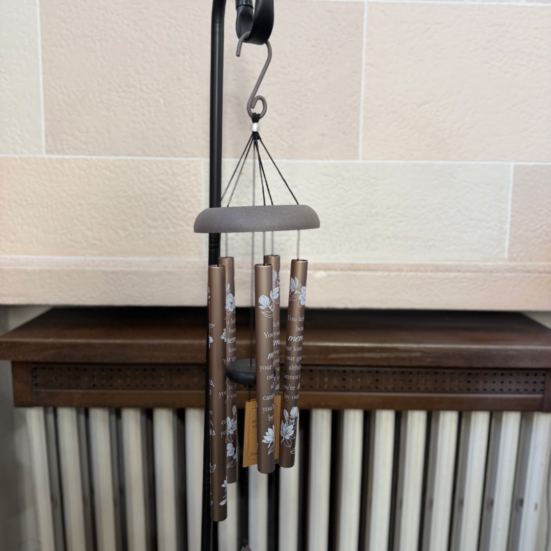 Brown memorial wind chime hanging indoors