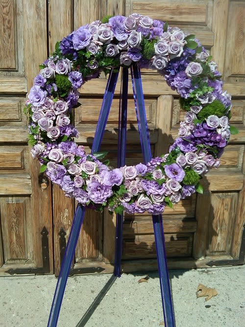 Purple floral wreath on a standing easel