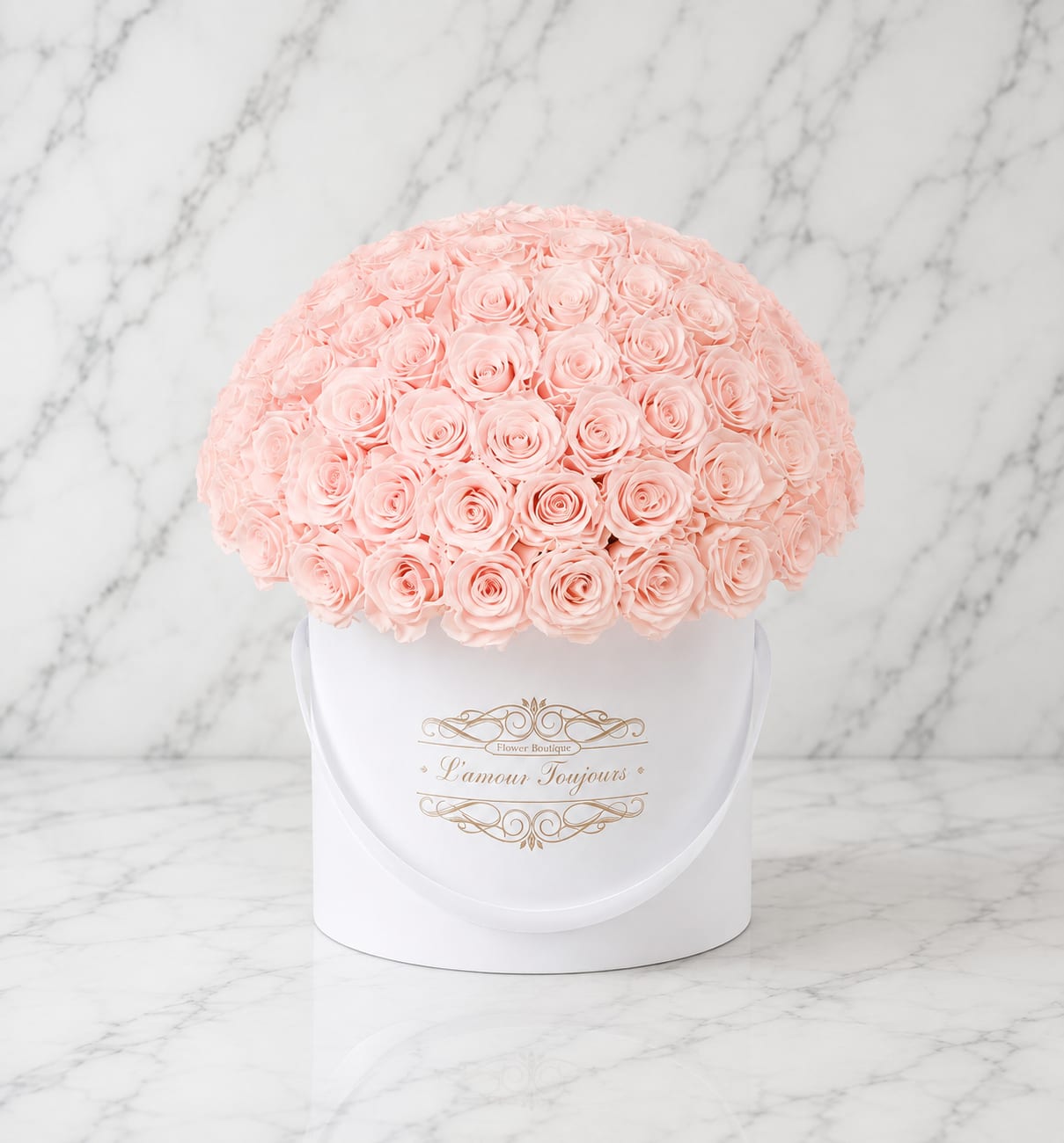 Round bouquet of pale pink roses in a white hat box
