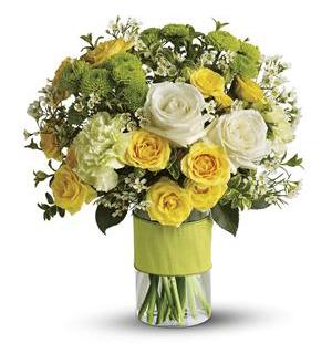 Yellow and white rose bouquet in a clear glass vase