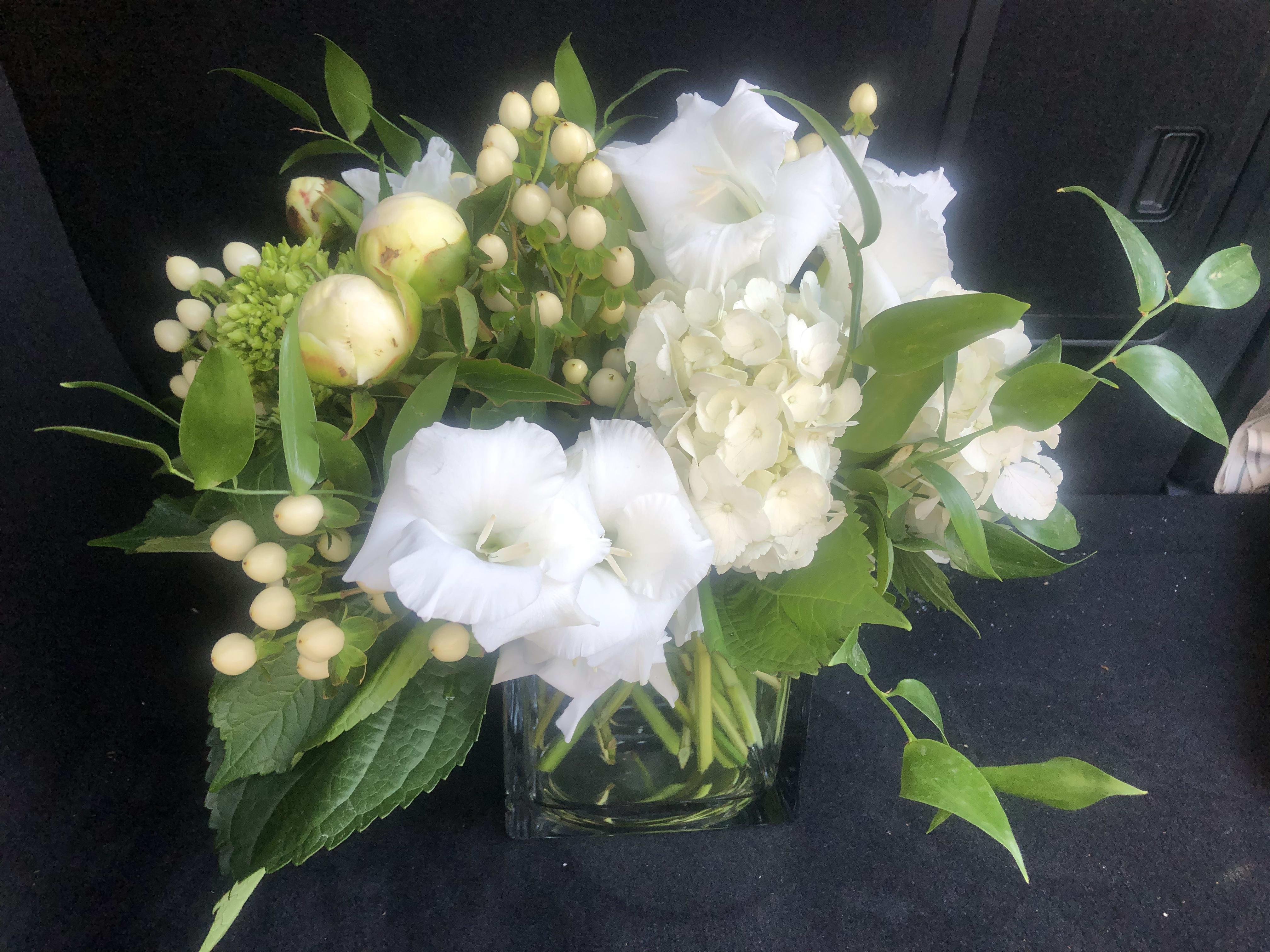 Christmas and Holiday Centerpieces and Bouquets - Christmas and Holiday Bouquets, Centerpieces, Wreaths and Garland. Prices vary.