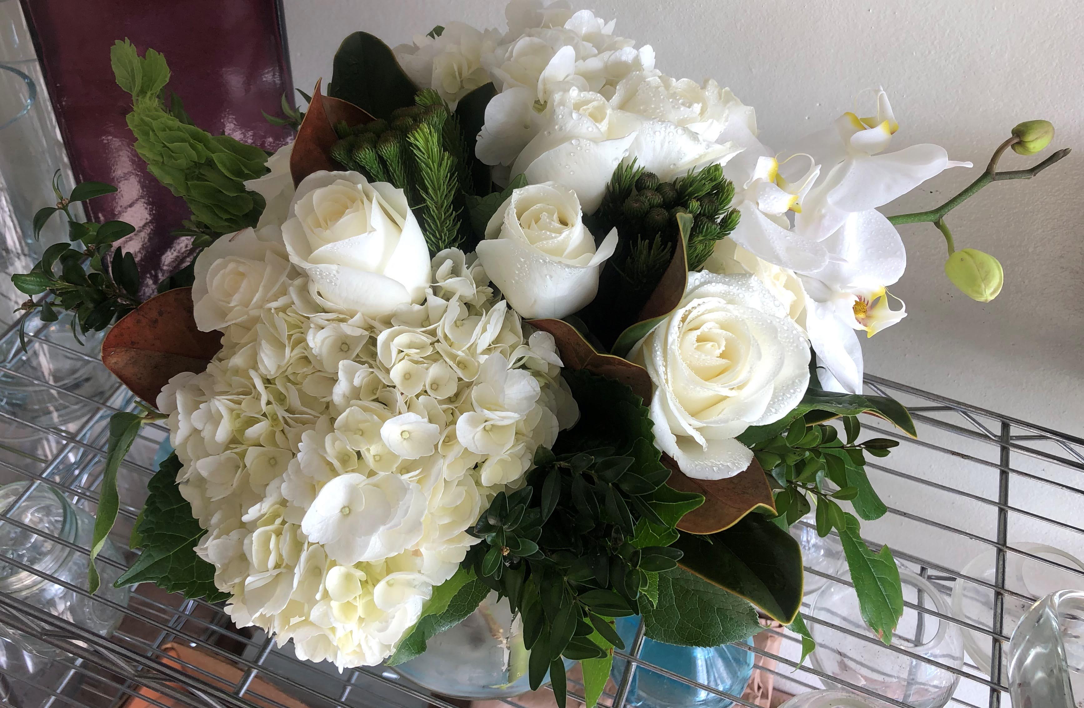 White Sugar Magnolias - Designers choice premium floral similar to as shown with hydrangeas and orchids and...