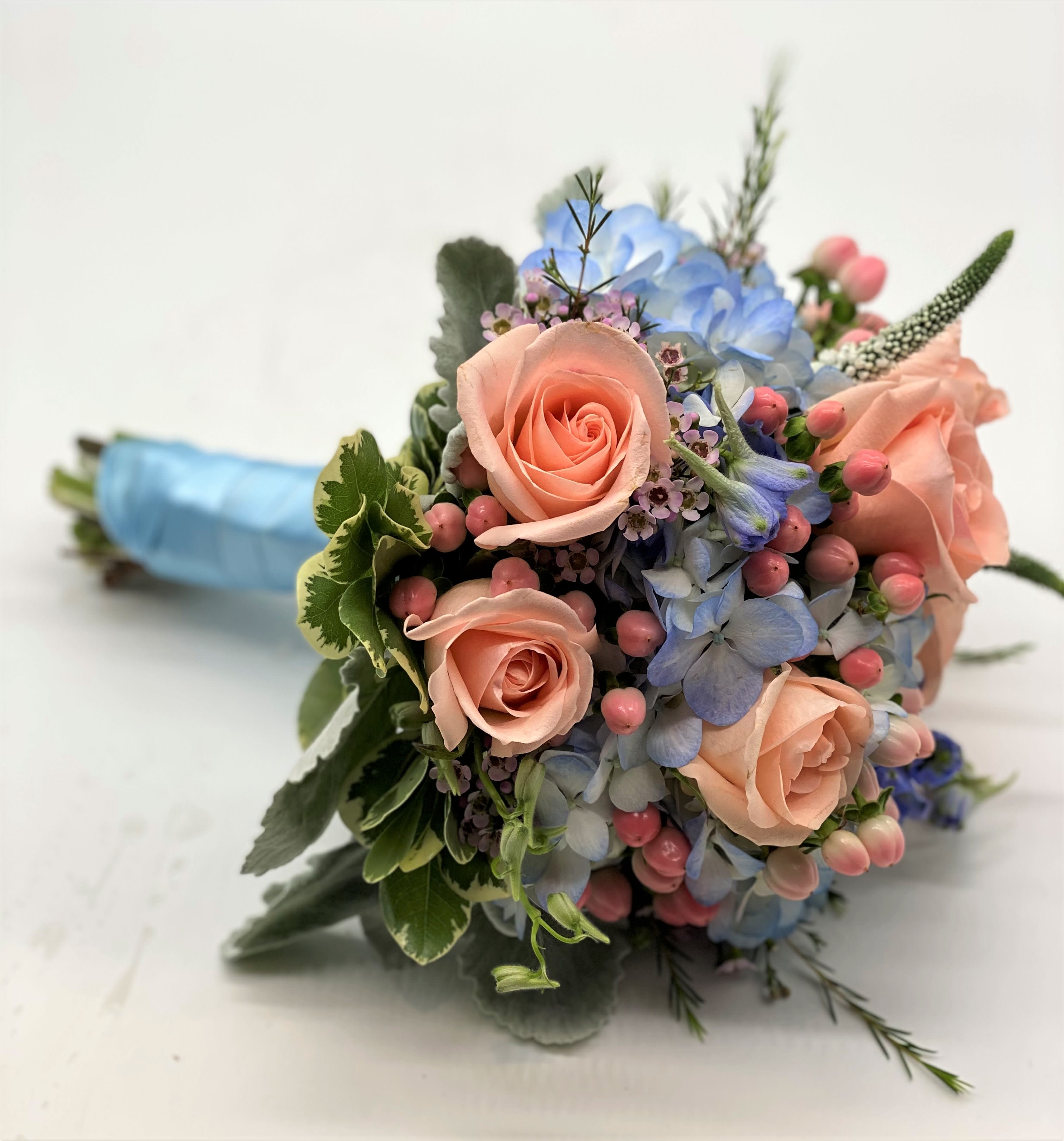The Coral Queen Clutch Bouquet - A gorgeous combination of blues and corals makes this bouquet stand out!!
