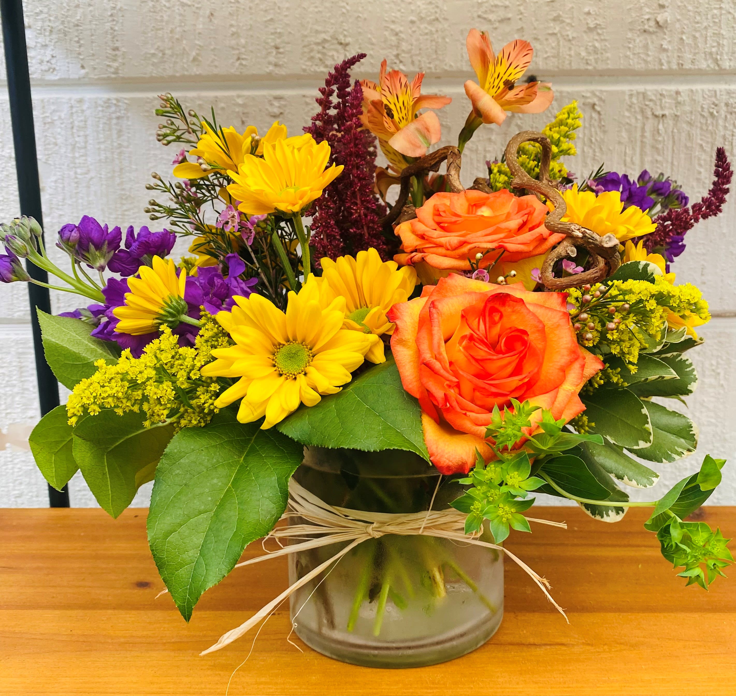 The Fall Cylinder - Fresh Mix of fall blooms designed in a clear cylinder vase.