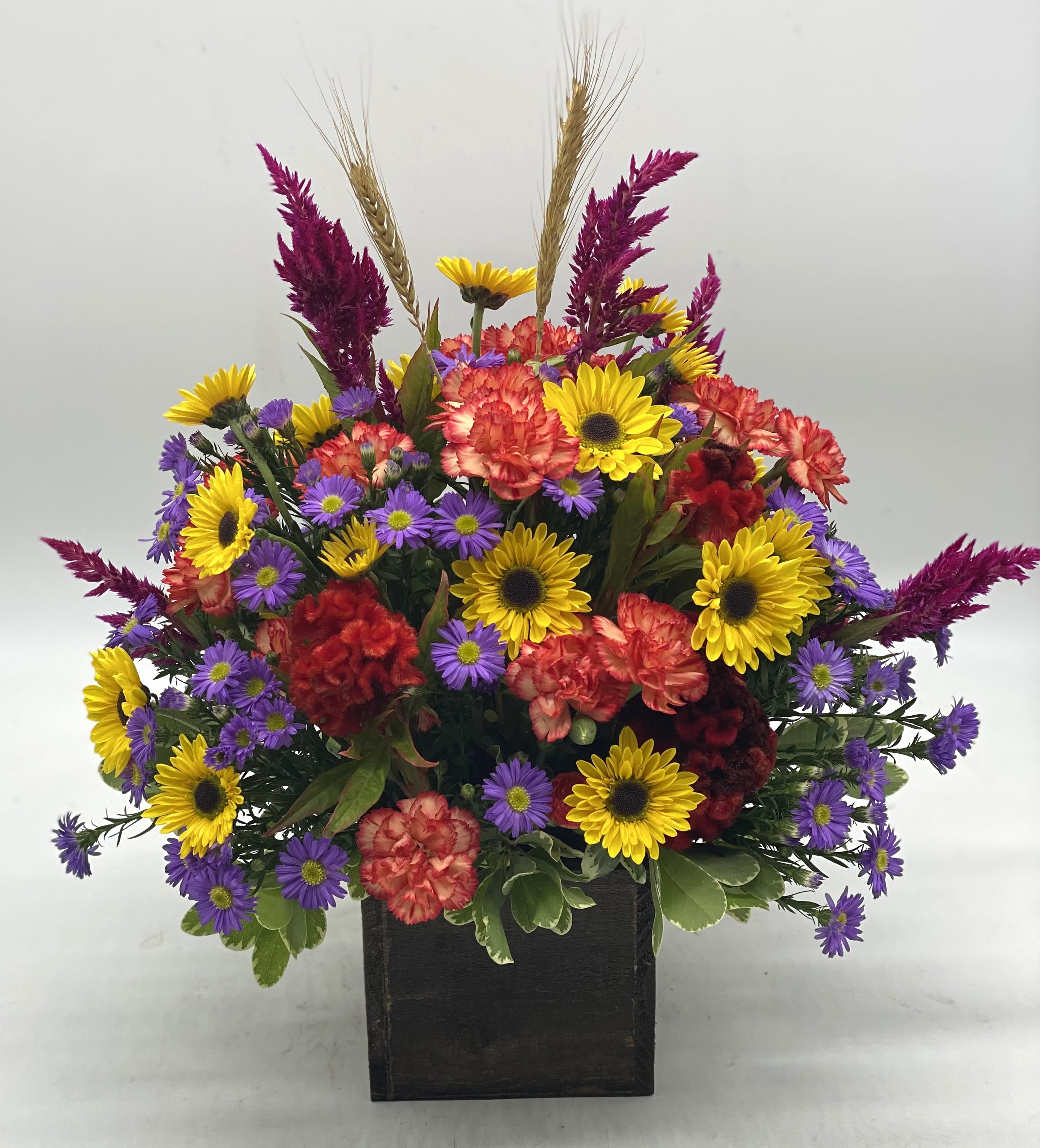 Autumn Glow Bouquet - A bright mix of fresh, fall toned flowers designed in a wooden box. Great decorative keepsake to reuse!
