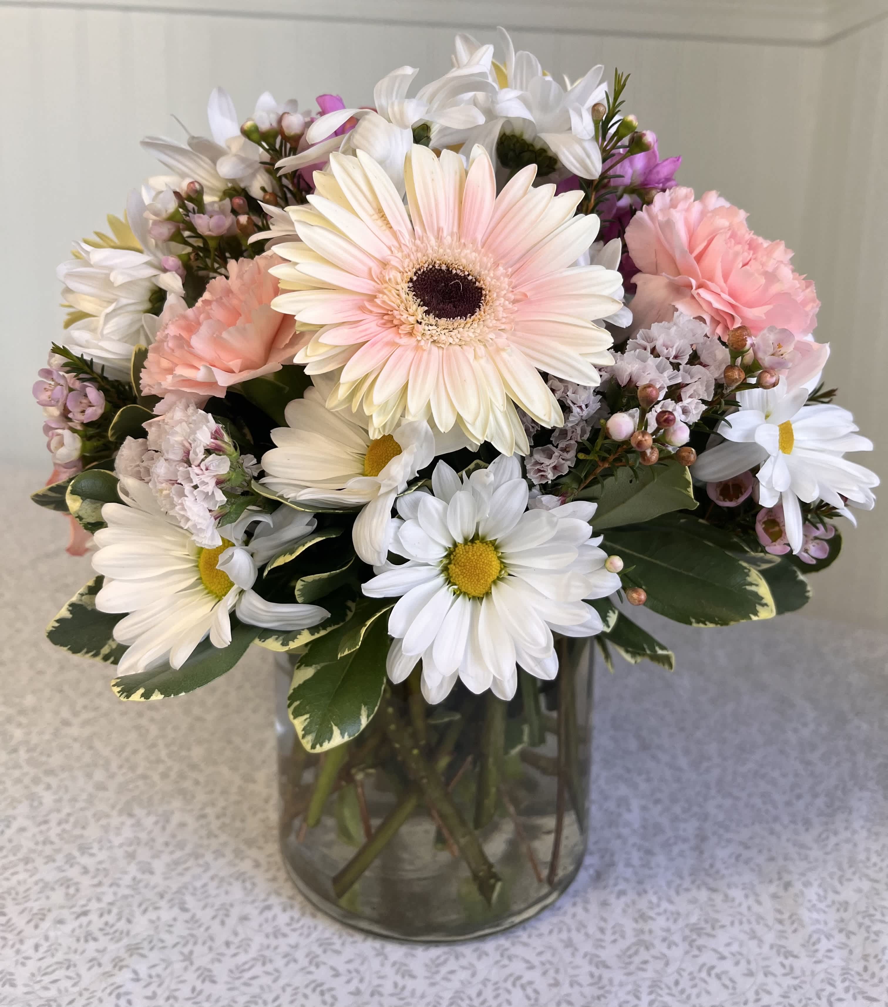 Pink and white mixed bouquet in a glass vase