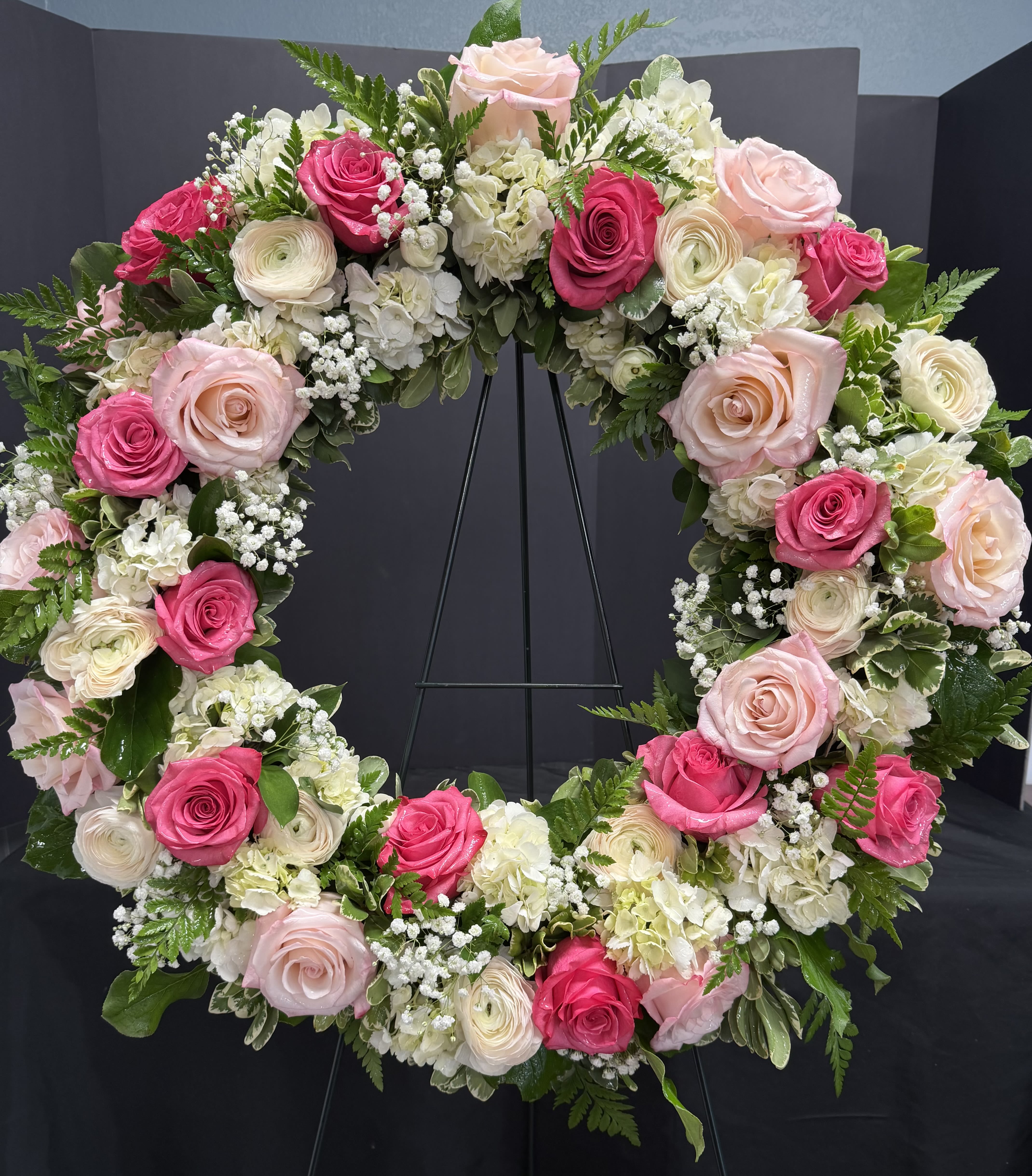 Forever Remembered Wreath - Forever remembered is a beatiful arrangemented designed by our awesome floriats.  Send to a service or memorial in memory of your cherished one. 