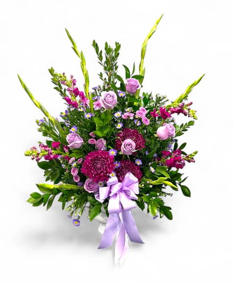 Lavender and pink mixed bouquet with a ribbon in a vase