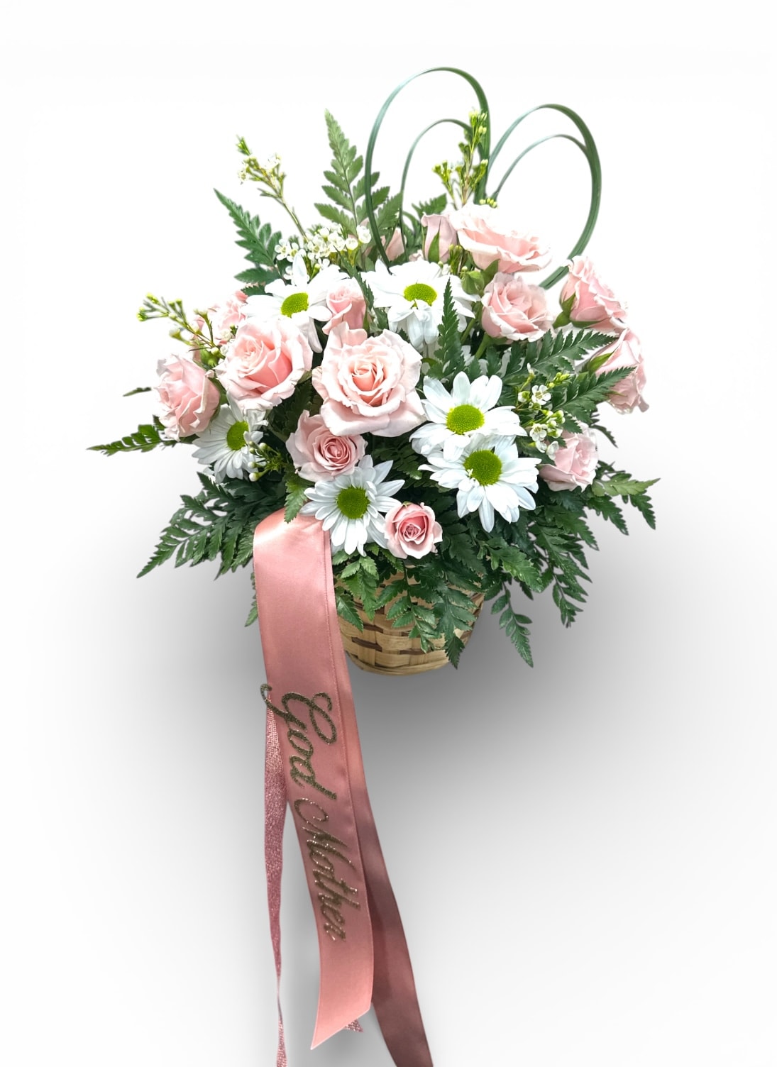 Pink roses and white daisies in a basket with a pink ribbon