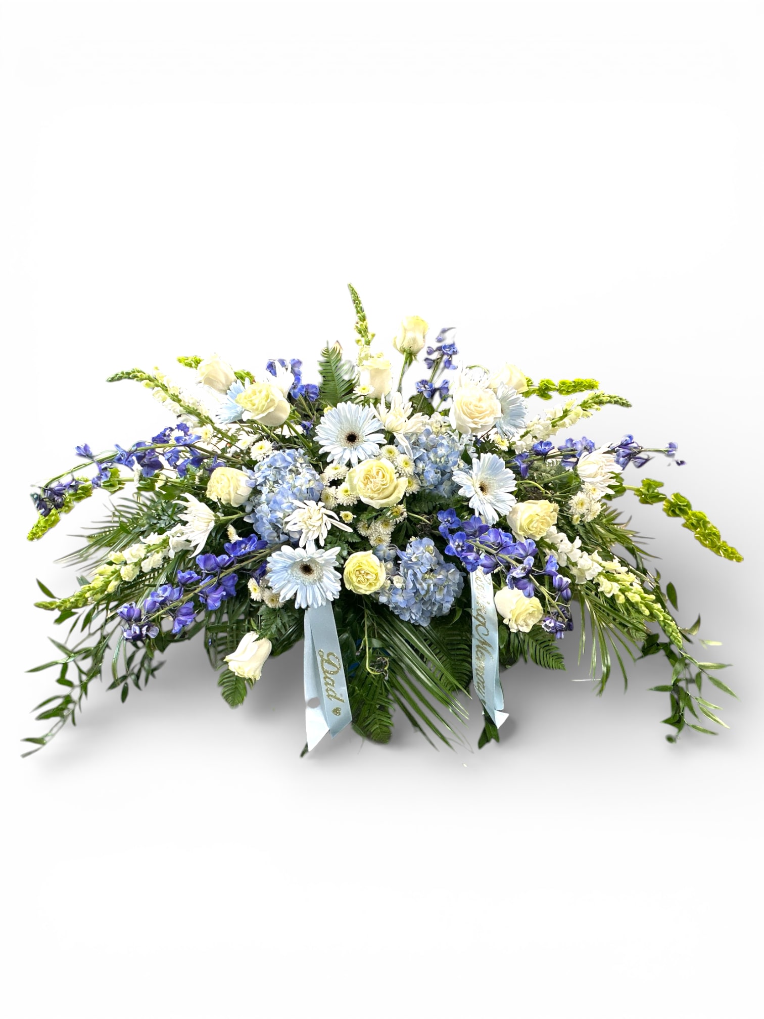 Large blue and white floral spray with ribbons